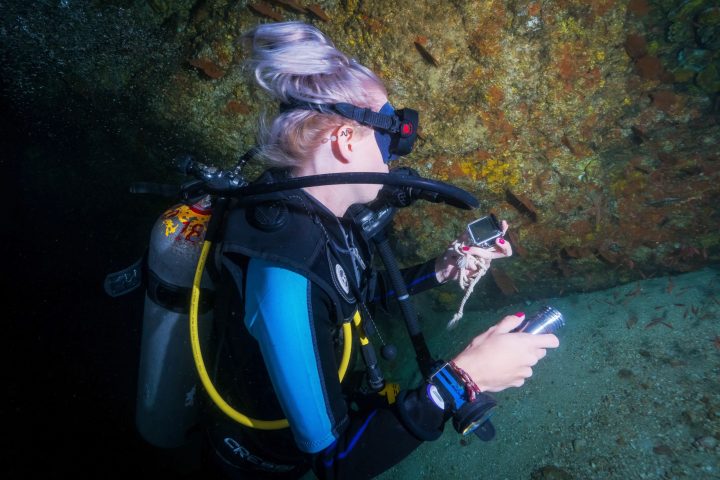 a person sitting in a swimming pool