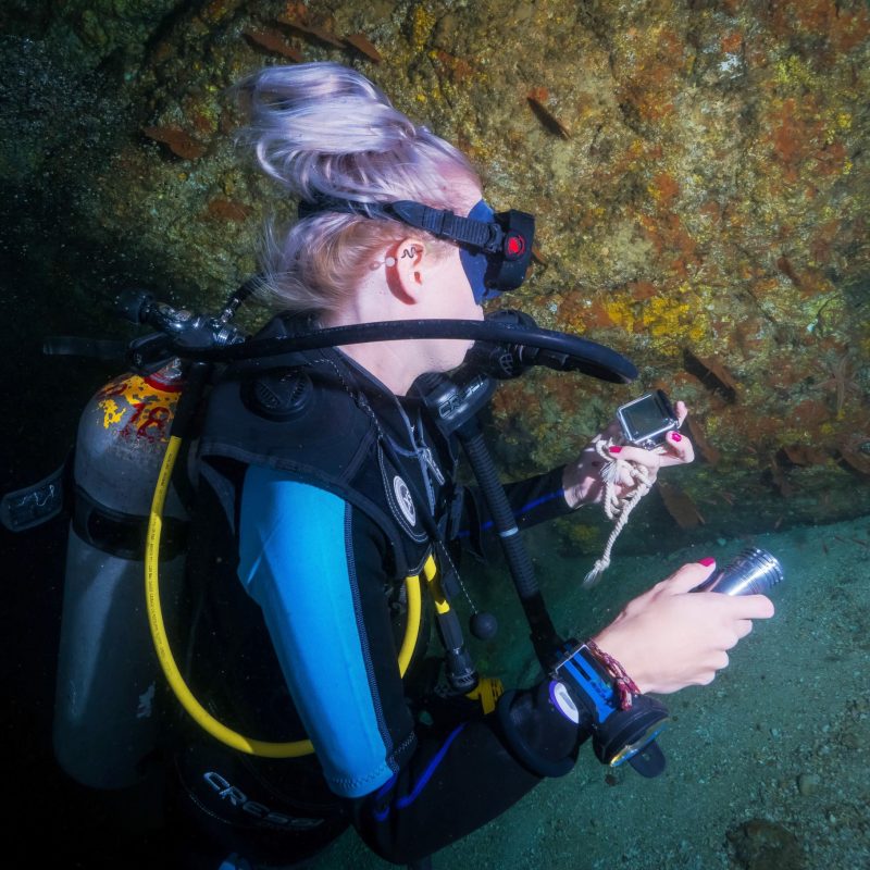 a person sitting in a swimming pool